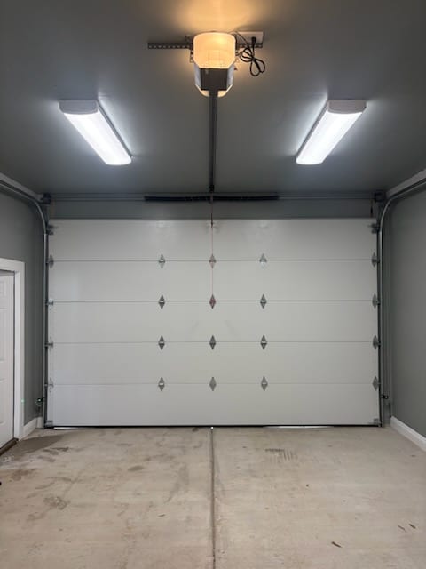 Residential garage door and opener during a maintenance tune-up